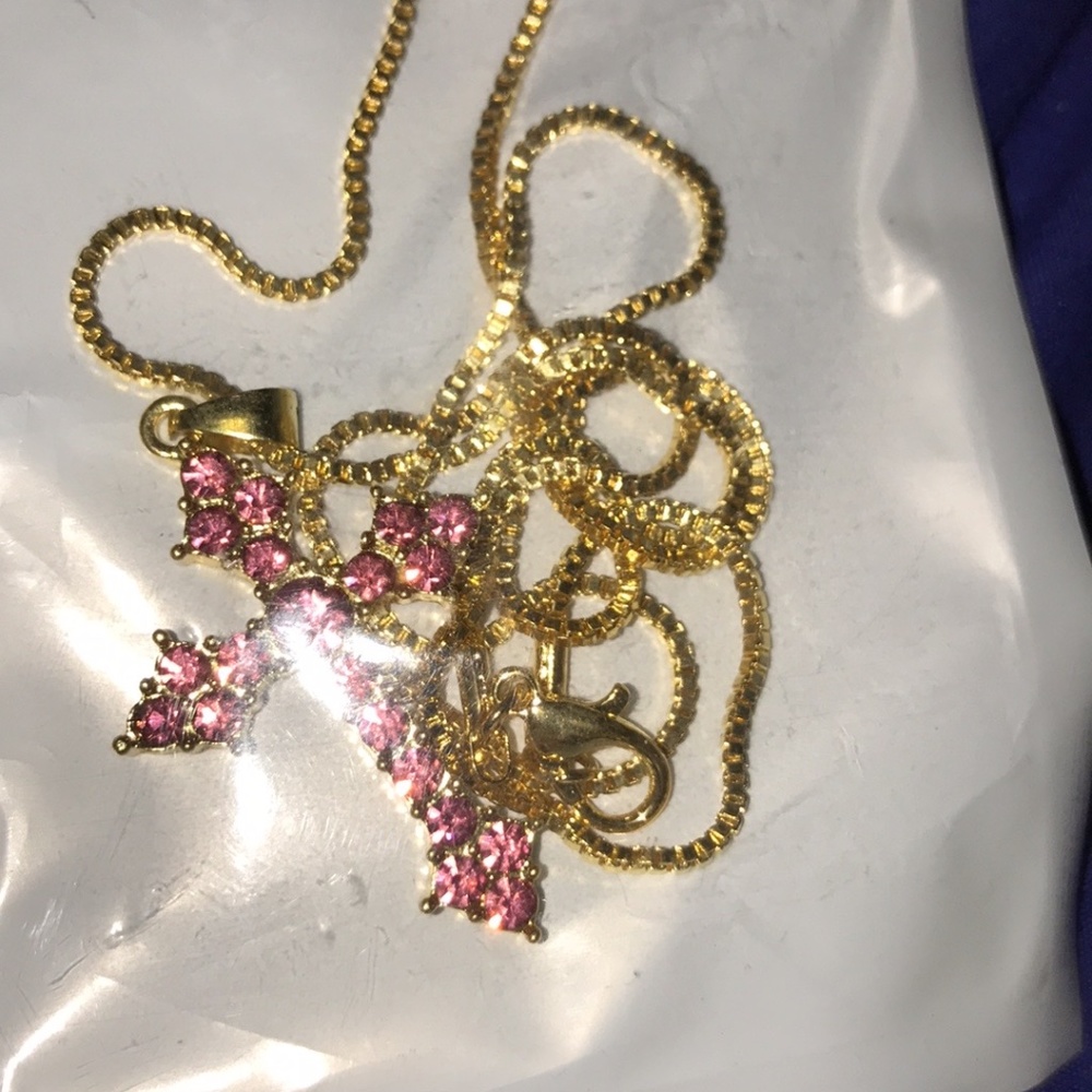 Golden cross necklaces with pink green and blue stones